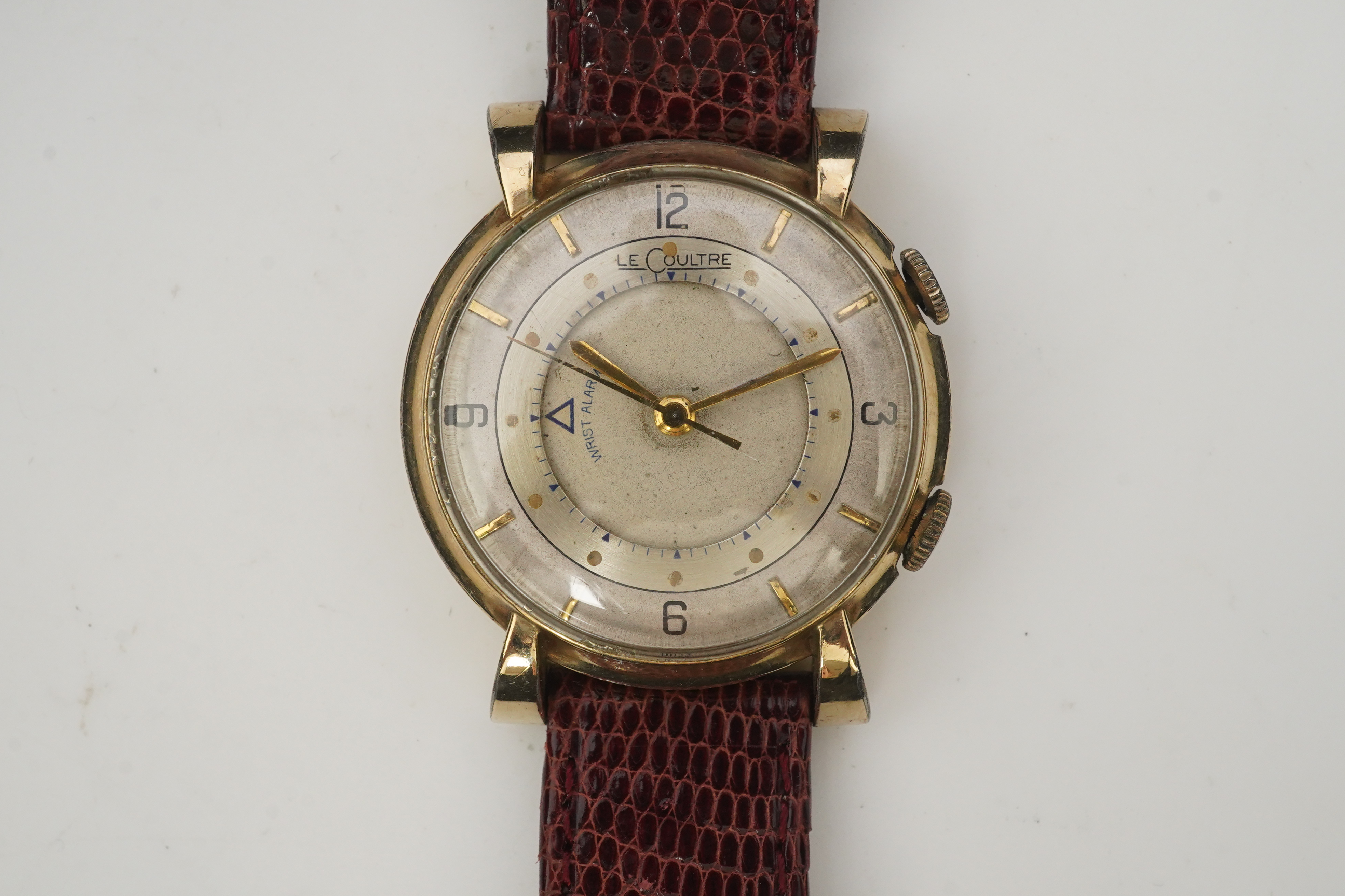 A gentleman's 1950's? 10k gold filled Jaeger LeCoultre Memovox manual wind wrist watch, on a later associated leather strap